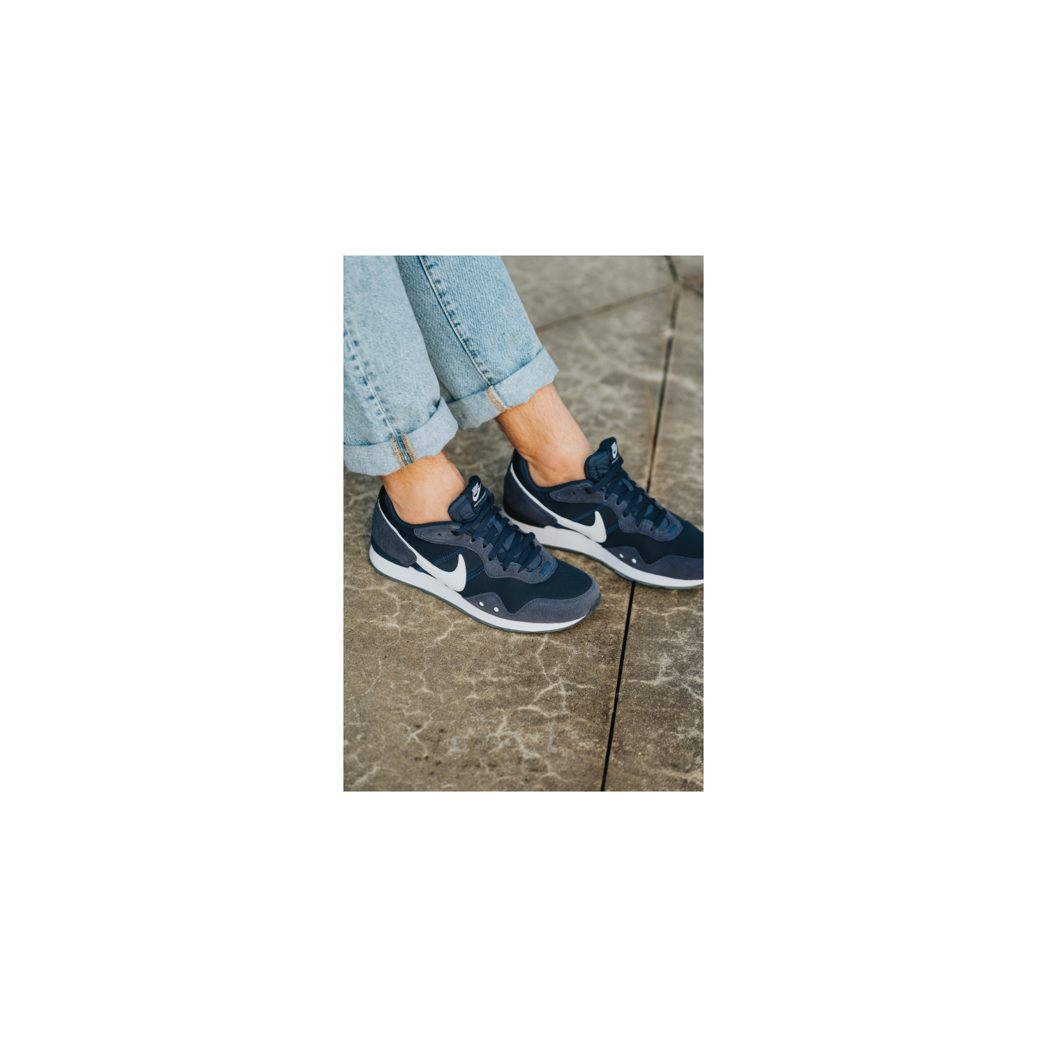 nike md runner on feet